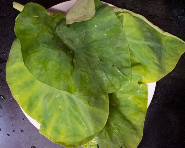 Separate Colocasia leaves from the bunch and wash them nicely, drain excess water and chop leaves finely.